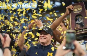 Pelatih kepala Dusty May mendekati tonggak sejarah saat bola basket Michigan menuju Final Four di Indy