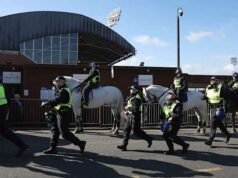 Millwall marah setelah buklet anti-rasisme menunjukkan lencananya pada jubah Ku Klux Klan